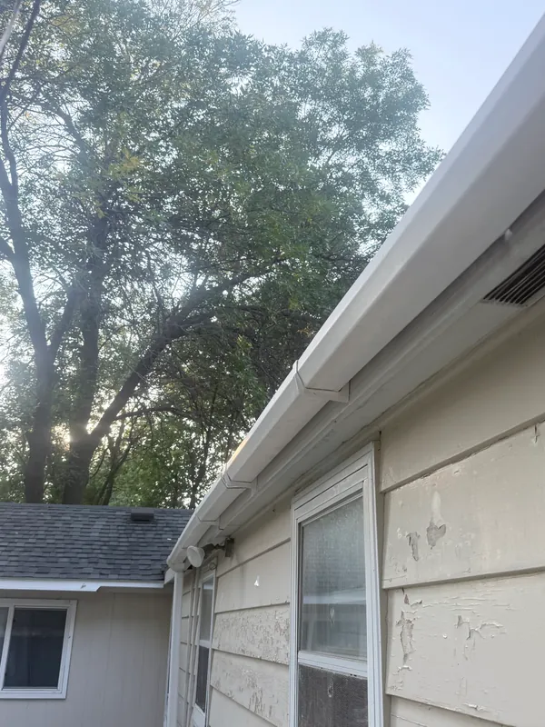 Long run of clean gutter along a house